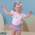 Toddler wearing Coral Organic T-Shirt with Frill | Snuggle Hunny