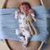 Baby wearing Dragon Organic Snuggle Sleepsuit Zip Footie | Snuggle Hunny
