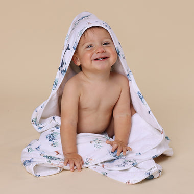 Toddler wrapped in Ocean Organic Baby Towel | Snuggle Hunny